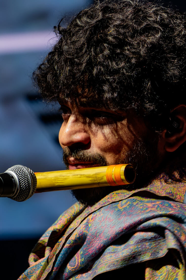 Bansuri player at the microphone